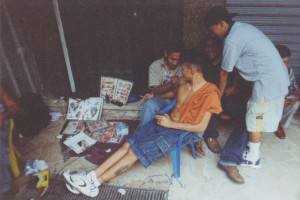 Tattooing outside in a vacant lot in Guayaquil, Ecuador, January 2002 (Photo by author).