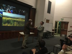 Lee Berger gifts Alabama Natural History Museum Bill Bomar a Homo naledi cast at his ALLELE/ANHM co-sponsored talk.